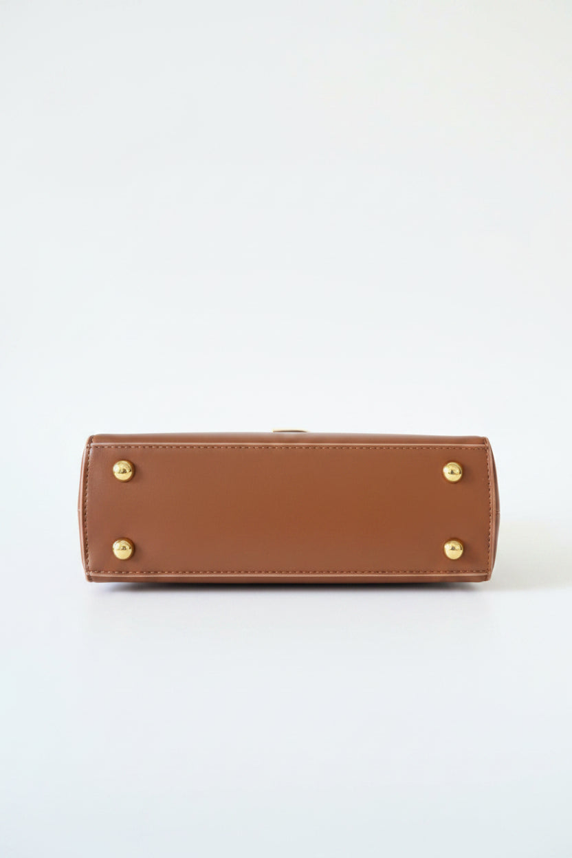 Sac brun rouille avec légère imperfection