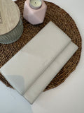 Pochette de voyage ou de soirée en cuir couleur crème de marque Danier
